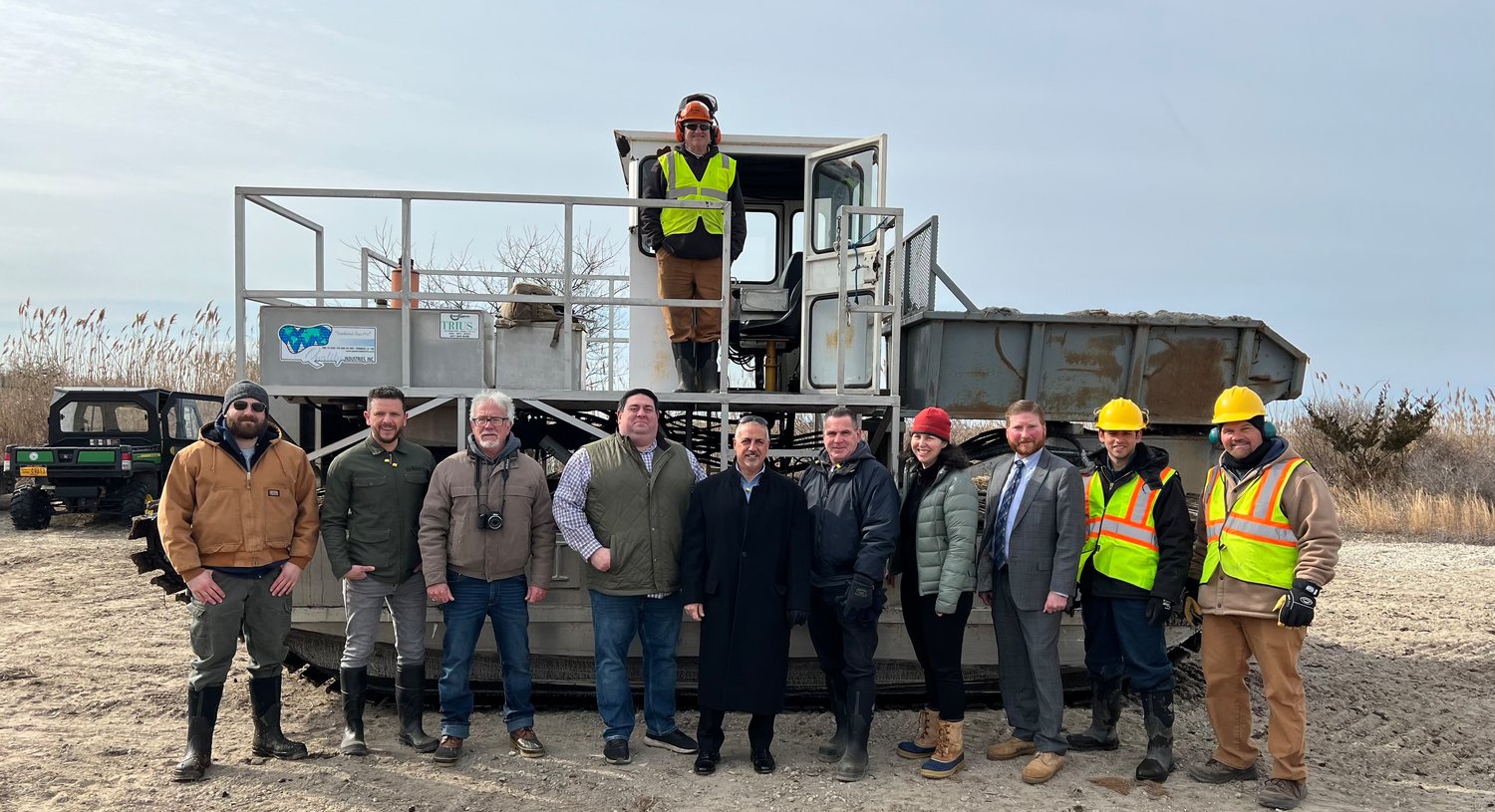 Legis. James Mazzarella (center) visits the location of the Tidal Wetland Restoration at Smith Point County Park to Improve Protection against Flooding and Storm Damage at the Smith Point Marina.